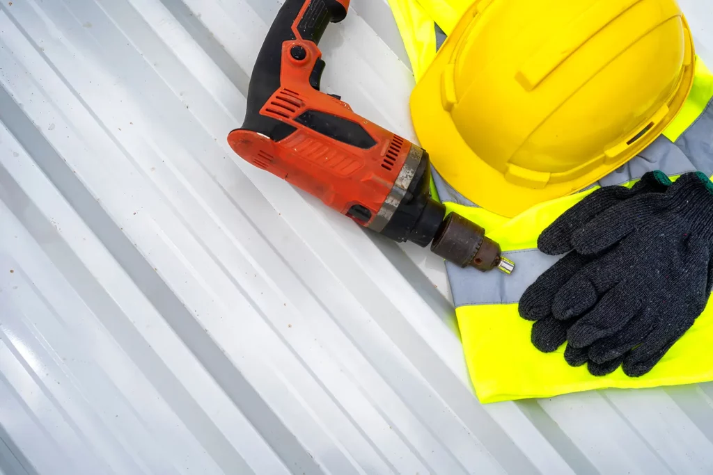 Closeup of roofer gear for tips on Mastering Commercial Roofing Code Compliance
