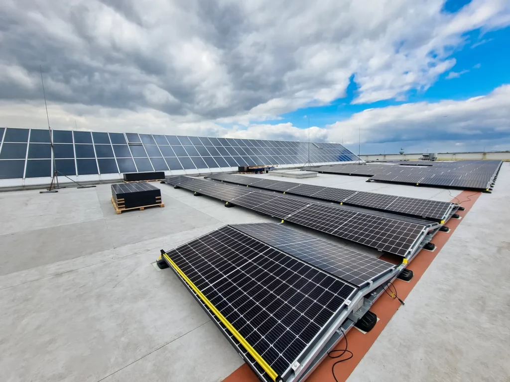 Solar panels on a flat rooftop, showcasing innovative sustainable materials in green commercial roofing