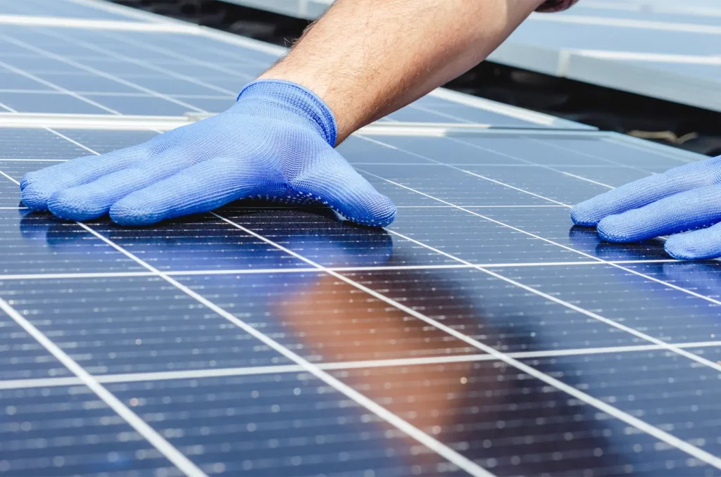 Closeup shot of a solar panel commercial roof integration in progress.