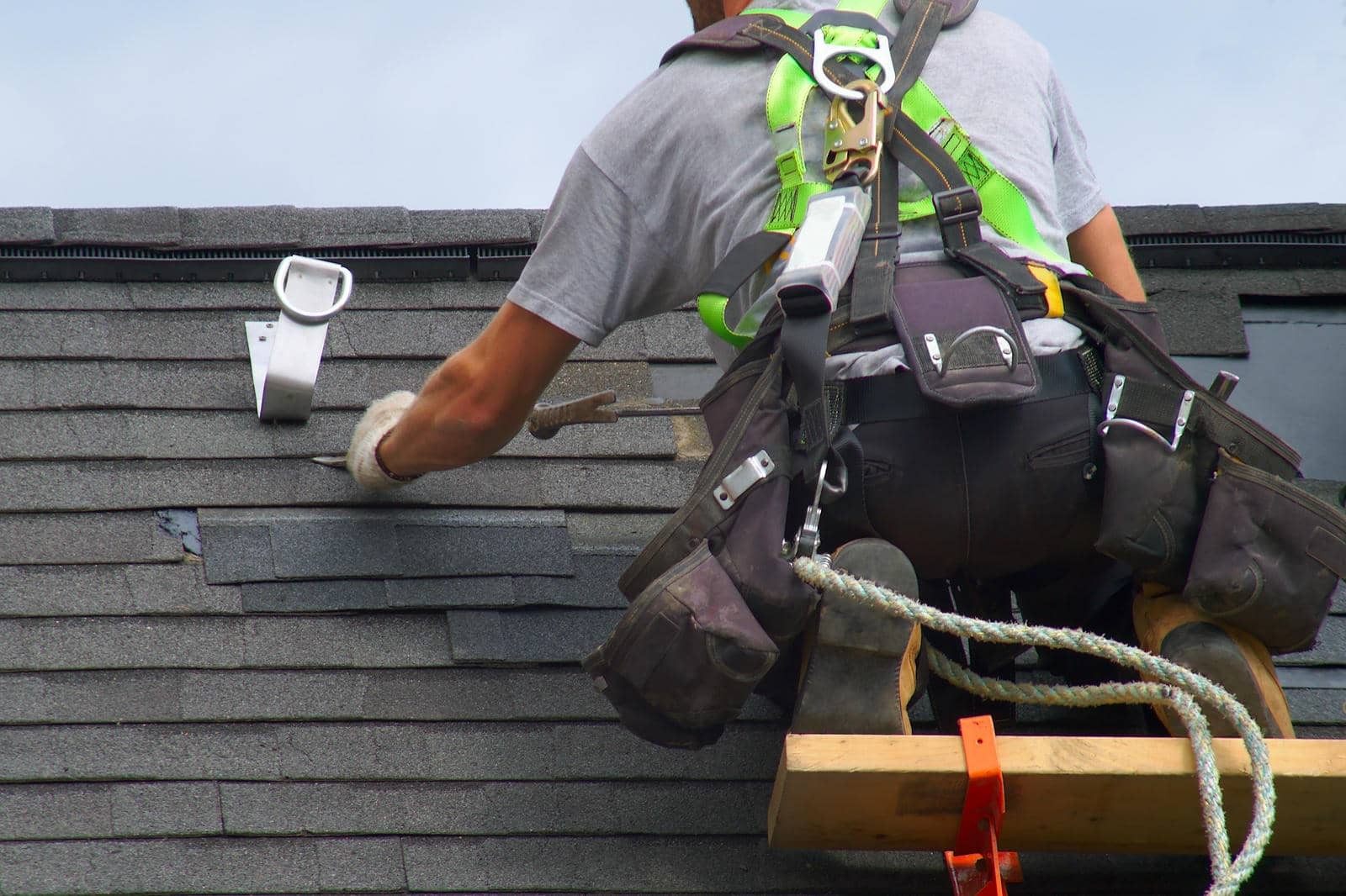 Worker repairing a flat roof