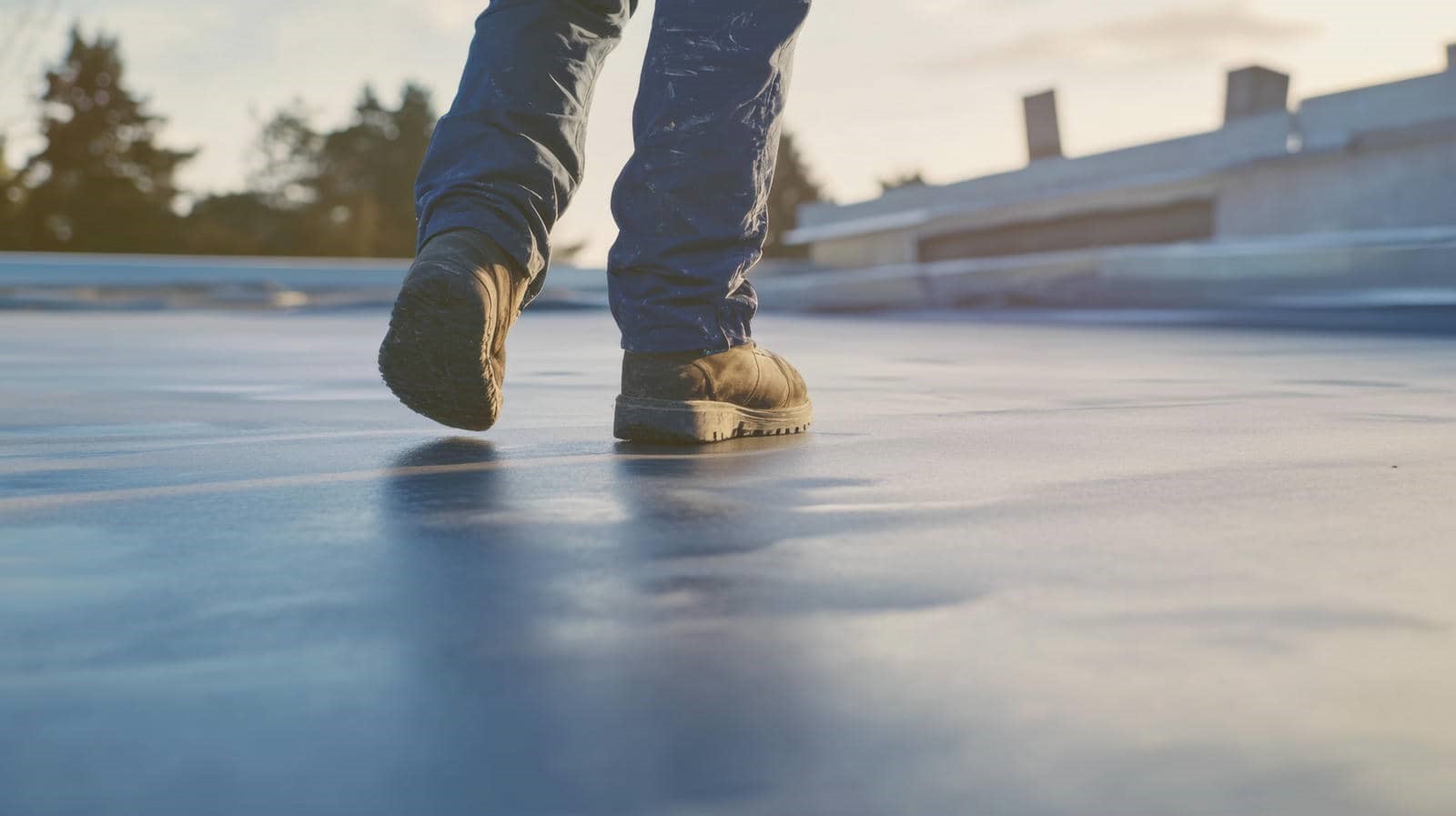 Person walking on flat roof surface