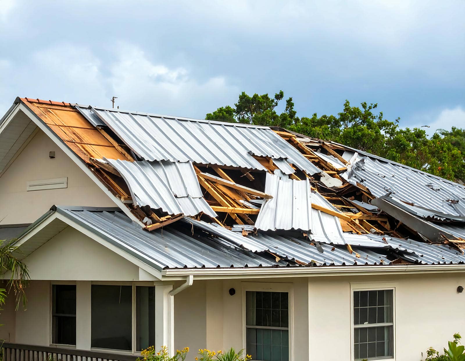 Damaged metal roof after severe storm.|Person inspecting wet flat roof|Worker repairing a flat roof.|Rain falling on metal roof|Rain falling on metal roof|Worker applying material on flat roof.|Severely damaged roof after storm|Lightning strikes during heavy rain.|Rainwater flowing off metal roof|Snow melting on roof gutter|Rain falling on a metal roof|Snow and ice on roof gutter|Severely damaged metal roof after storm|Snow-covered roof with shingles visible.|Icicles hanging from a roof