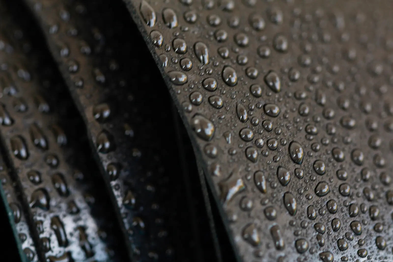 Closeup of water drops on a rubber material